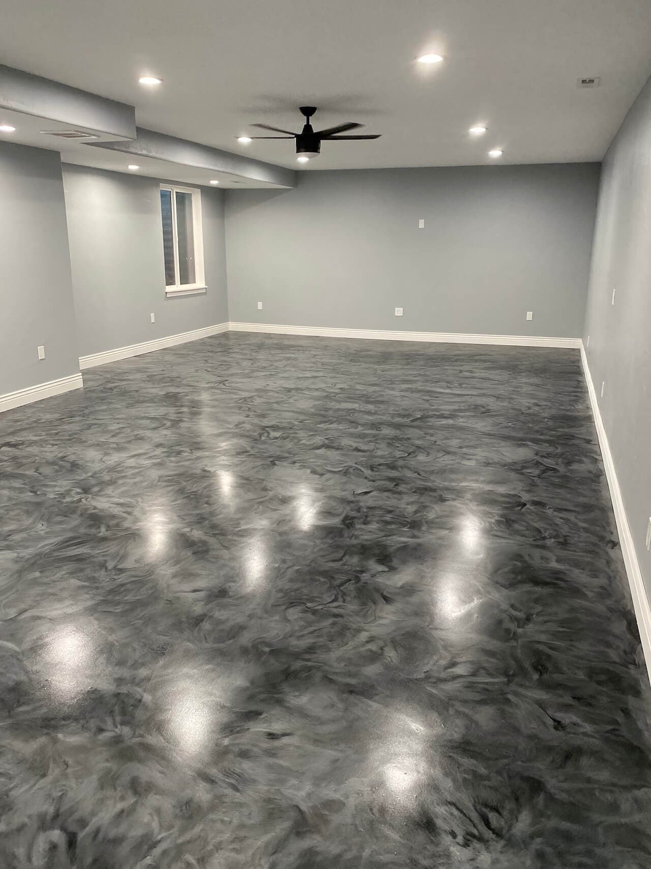 Bright metallic epoxy basement in downtown Toronto
