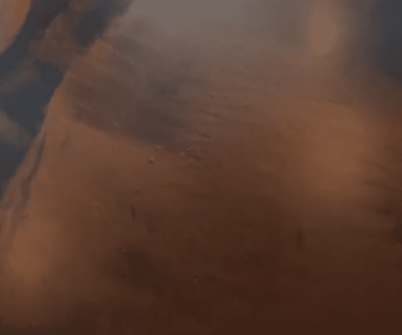 Coffee and Black metallic epoxy flooring example – stunning swirl pattern in Toronto