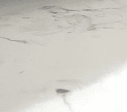 White with Black Highlights metallic epoxy flooring example – stunning swirl pattern in Toronto